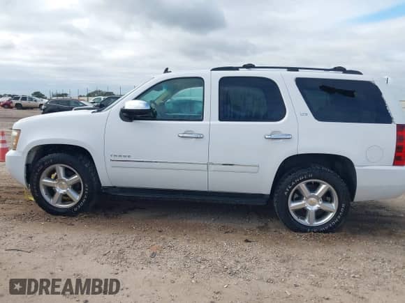 2011 Chevrolet Tahoe LTZ with VIN 1GNSCCE02BR385545, listed as a IAAI auction lot 43384333 with 255,376 mi miles and . Bid and sale history available at DreamBid. Image 14.