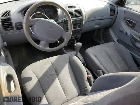 2003 Hyundai Accent GL с VIN KMHCG35CX3U270374, выставлен на аукционе Copart как лот 47240325 с пробегом 122 739 миль миль и Списание • Salvage title. История ставок и продаж доступна на DreamBid. Изображение 8.