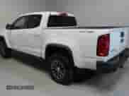 2020 Chevrolet Colorado 4WD ZR2 with VIN 1GCPTEE19L1134962, listed as a Copart auction lot 59032865 with 143,010 mi miles and Salvage title. Bid and sale history available at DreamBid. Image 4.