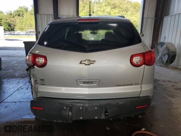 2010 Chevrolet Traverse LS z VIN 1GNLVEED6AJ236050, wystawiony jako Copart lot #67088695 z przebiegiem Nie podano mil oraz Szkoda całkowita • Salvage title. Historia ofert i sprzedaży dostępna na DreamBid. Obrazek 6.