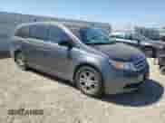 2013 Honda Odyssey EX-L z VIN 5FNRL5H65DB003388, wystawiony jako Copart lot #65637255 z przebiegiem 136 320 mil mil oraz Szkoda całkowita • Salvage title. Historia ofert i sprzedaży dostępna na DreamBid. Obrazek 4.