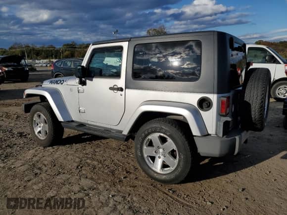 2010 Jeep Wrangler Sahara z VIN 1J4AA5D10AL108467, wystawiony jako Copart lot #89720615 z przebiegiem 158 003 mil mil oraz Czysty tytuł • Clean title. Historia ofert i sprzedaży dostępna na DreamBid. Obrazek 2.