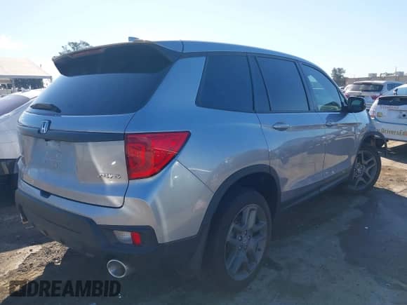 2023 Honda Passport EX-L with VIN 5FNYF8H50PB036640, listed as a IAAI auction lot 42536022 with 1,658 mi miles and . Bid and sale history available at DreamBid. Image 4.