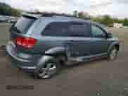 2010 Dodge Journey SXT with VIN 3D4PG5FV7AT117950, listed as a Copart auction lot 82028075 with 65,015 mi miles and Salvage title. Bid and sale history available at DreamBid. Image 3.