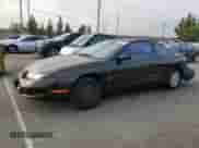 1997 Saturn SC with VIN 1G8ZF1286VZ350275, listed as a Copart auction lot 83010514 with 143,241 mi miles and Salvage title. Bid and sale history available at DreamBid. Image 1.
