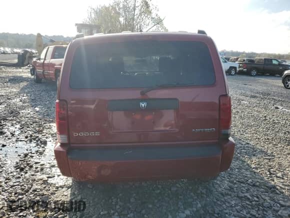 2009 Dodge Nitro SXT z VIN 1D8GU28K99W541922, wystawiony jako Copart lot #79276954 z przebiegiem 61 533 mil mil oraz Szkoda całkowita • Salvage title. Historia ofert i sprzedaży dostępna na DreamBid. Obrazek 6.