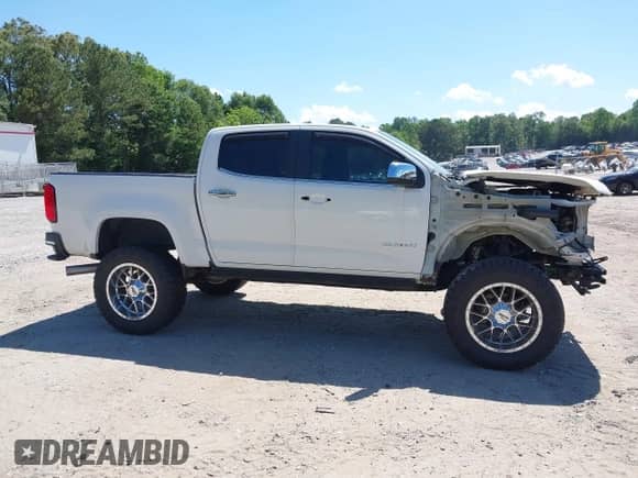 2018 Chevrolet Colorado 4WD LT with VIN 1GCPTCE15J1258521, listed as a IAAI auction lot 42336614 with 66,708 mi miles and . Bid and sale history available at DreamBid. Image 14.