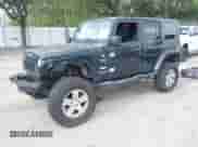 2007 Jeep Wrangler Unlimited Sahara z VIN 1J8GA59187L104774, wystawiony jako IAAI lot #42485359 z przebiegiem 192 254 mil mil oraz . Historia ofert i sprzedaży dostępna na DreamBid. Obrazek 2.