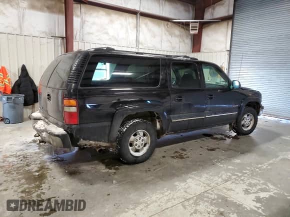 2000 Chevrolet Suburban LT z VIN 3GNFK16T6YG148888, wystawiony jako Copart lot #45715395 z przebiegiem Nie podano mil oraz Czysty tytuł • Clean title. Historia ofert i sprzedaży dostępna na DreamBid. Obrazek 3.
