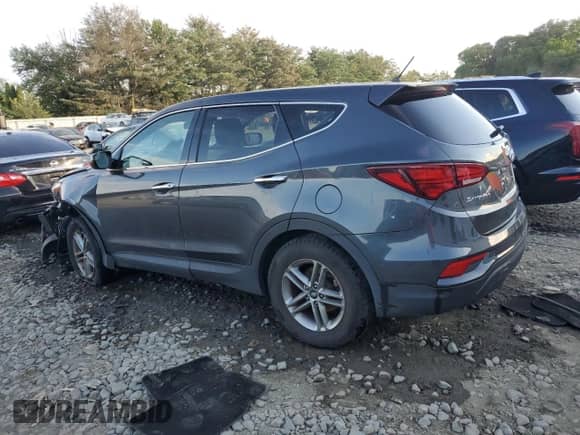 2018 Hyundai Santa Fe 2.4L with VIN 5XYZTDLBXJG546447, listed as a Copart auction lot 65197905 with 75,551 mi miles and Salvage title. Bid and sale history available at DreamBid. Image 2.