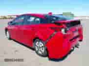 2021 Toyota Prius L Eco with VIN JTDKAMFU6M3152201, listed as a IAAI auction lot 43278670 with 144,414 mi miles and . Bid and sale history available at DreamBid. Image 3.