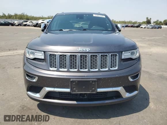 2014 Jeep Grand Cherokee Summit with VIN 1C4RJFJT6EC481846, listed as a Copart auction lot 71051545 with 216,706 mi miles and Salvage title. Bid and sale history available at DreamBid. Image 5.