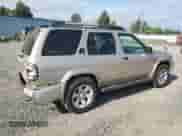 2002 Nissan Pathfinder SE with VIN JN8DR09Y92W737220, listed as a Copart auction lot 67274635 with 180,316 mi miles and Salvage title. Bid and sale history available at DreamBid. Image 3.