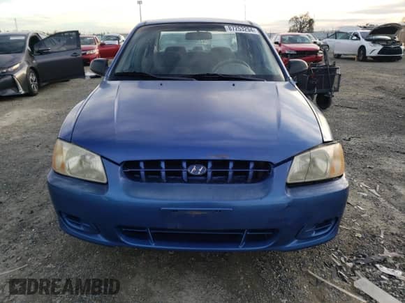 2000 Hyundai Accent z VIN KMHCG45GXYU125691, wystawiony jako Copart lot #87253294 z przebiegiem 91 062 mil mil oraz Szkoda całkowita • Salvage title. Historia ofert i sprzedaży dostępna na DreamBid. Obrazek 5.