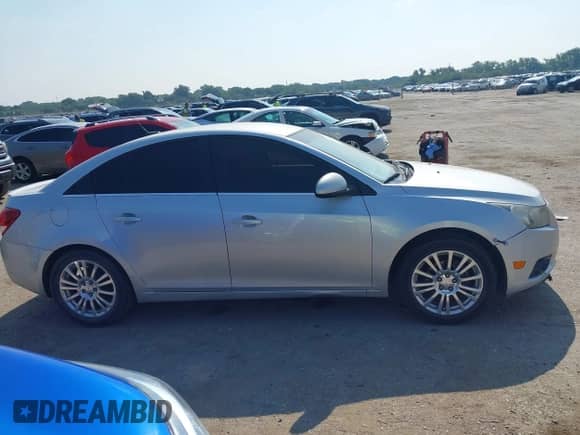 2012 Chevrolet Cruze ECO z VIN 1G1PJ5SC0C7266333, wystawiony jako IAAI lot #42906370 z przebiegiem 158 115 mil mil oraz . Historia ofert i sprzedaży dostępna na DreamBid. Obrazek 13.