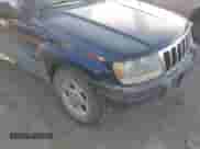 2002 Jeep Grand Cherokee Sport with VIN 1J4GW38S32C181840, listed as a IAAI auction lot 43237876 with 157,878 mi miles and . Bid and sale history available at DreamBid. Image 6.