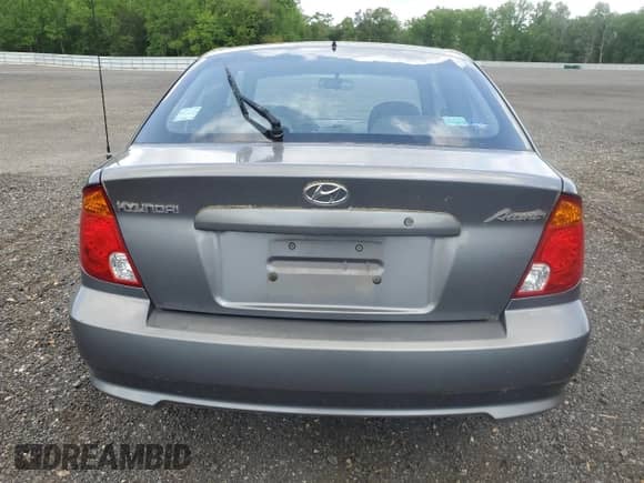 2005 Hyundai Accent GLS с VIN KMHCG35C15U342811, выставлен на аукционе Copart как лот 54855705 с пробегом 39 299 миль миль и Чистый • Clean title. История ставок и продаж доступна на DreamBid. Изображение 6.