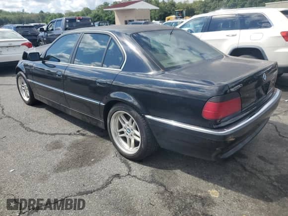 1998 BMW 7 Series 740i with VIN WBAGF8326WDL53656, listed as a Copart auction lot 70682725 with 197,610 mi miles and Salvage title. Bid and sale history available at DreamBid. Image 2.