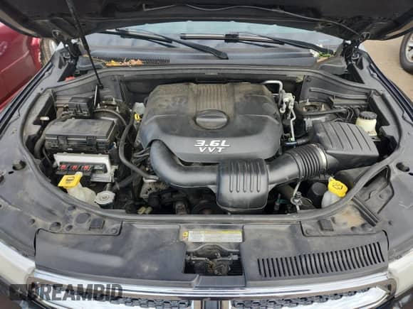 2013 Dodge Durango Crew with VIN 1C4RDJDG5DC509465, listed as a Copart auction lot 87090895 with 146,985 mi miles and Salvage title. Bid and sale history available at DreamBid. Image 11.
