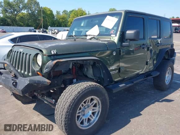 2007 Jeep Wrangler Unlimited Sahara с VIN 1J4GA59157L198095, выставлен на аукционе IAAI как лот 43011519 с пробегом 198 022 миль миль и . История ставок и продаж доступна на DreamBid. Изображение 2.