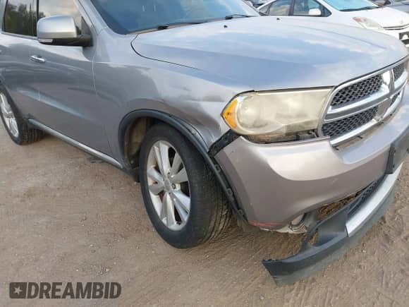 2013 Dodge Durango Crew z VIN 1C4RDHDG7DC687113, wystawiony jako IAAI lot #43212560 z przebiegiem 167 338 mil mil oraz . Historia ofert i sprzedaży dostępna na DreamBid. Obrazek 6.