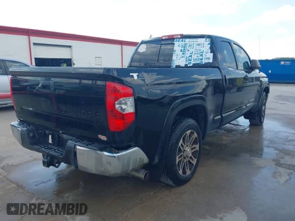 2014 Toyota Tundra SR with VIN 5TFRM5F11EX080643, listed as a IAAI auction lot 43296399 with 247,504 mi miles and . Bid and sale history available at DreamBid. Image 4.