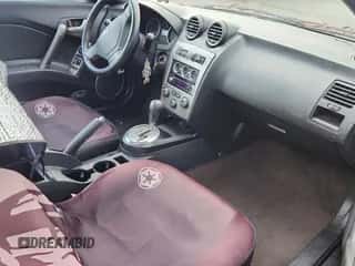 2008 Hyundai Tiburon GT с VIN KMHHN66F58U272806, выставлен на аукционе Copart как лот 78637414 с пробегом 70 373 миль миль и Чистый • Clean title. История ставок и продаж доступна на DreamBid. Изображение 5.