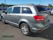 2013 Dodge Journey SXT with VIN 3C4PDCBB0DT583309, listed as a IAAI auction lot 43394726 with 128,326 mi miles and . Bid and sale history available at DreamBid. Image 3.