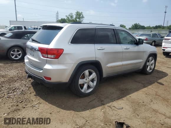 2011 Jeep Grand Cherokee Overland Summit with VIN 1J4RR6GTXBC536210, listed as a Copart auction lot 62634765 with 129,835 mi miles and Salvage title. Bid and sale history available at DreamBid. Image 3.