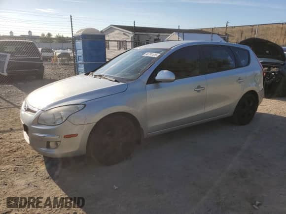 2009 Hyundai Elantra Touring with VIN KMHDC86E09U038792, listed as a Copart auction lot 84791125 with 172,061 mi miles and Salvage title. Bid and sale history available at DreamBid. Image 1.