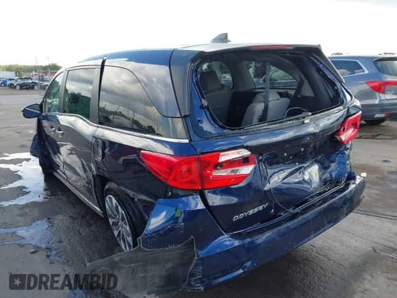 2023 Honda Odyssey EX-L with VIN 5FNRL6H60PB035093, listed as a IAAI auction lot 42744574 with 69,569 mi miles and . Bid and sale history available at DreamBid. Image 3.