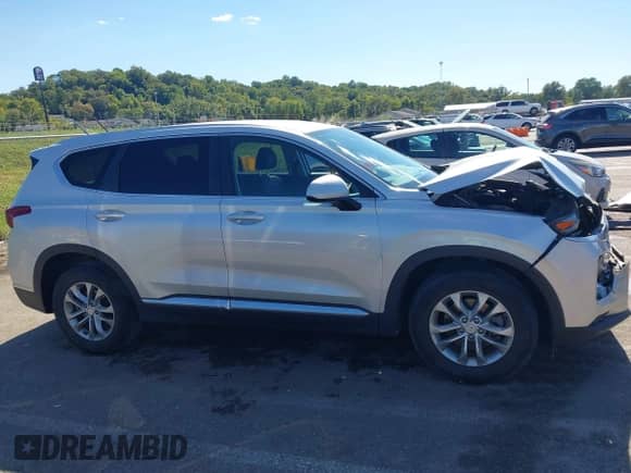 2019 Hyundai Santa Fe SE with VIN 5NMS23AD4KH100188, listed as a IAAI auction lot 43374582 with 88,759 mi miles and . Bid and sale history available at DreamBid. Image 13.