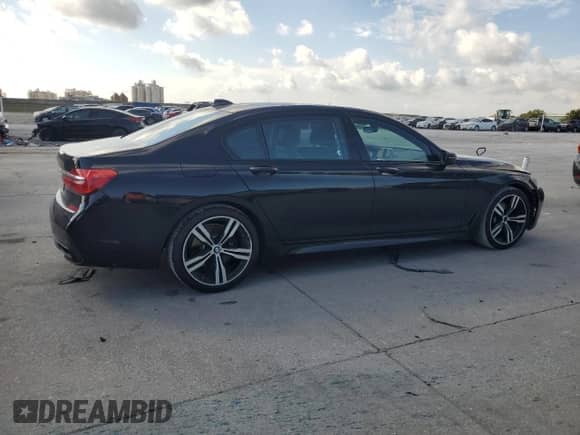 2016 BMW 7 Series 740i with VIN WBA7E2C53GG714660, listed as a Copart auction lot 68728045 with 120,581 mi miles and Salvage title. Bid and sale history available at DreamBid. Image 3.