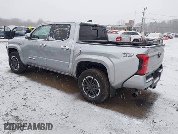 2024 Toyota Tacoma SR5 with VIN 3TMLB5JN6RM018639, listed as a IAAI auction lot 41251861 with 10,088 mi miles and . Bid and sale history available at DreamBid. Image 3.