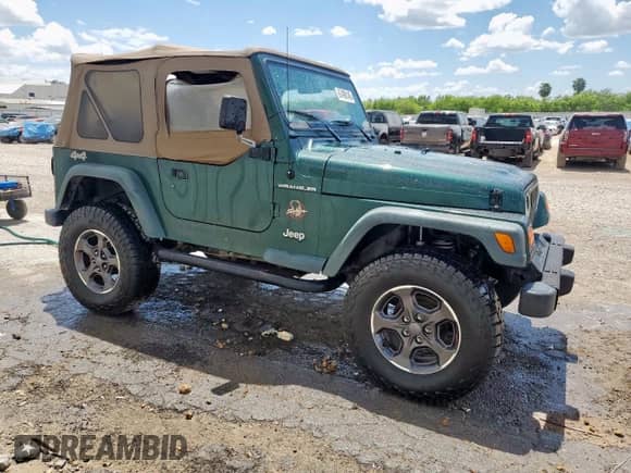 2000 Jeep Wrangler SE with VIN 1J4FA29P2YP800721, listed as a Copart auction lot 67490145 with 128,182 mi miles and Clean title. Bid and sale history available at DreamBid. Image 4.
