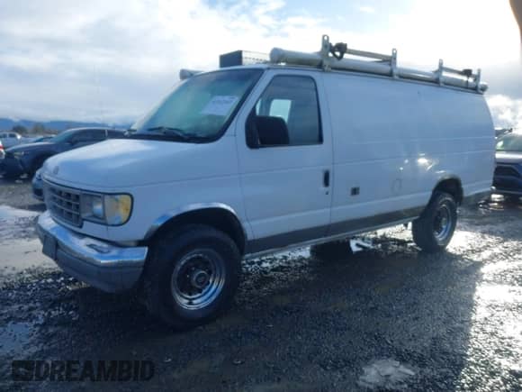 1992 Ford Econoline Cargo with VIN 1FTHS24H5NHB42507, listed as a IAAI auction lot 41512347 with 373,987 mi miles and . Bid and sale history available at DreamBid. Image 2.
