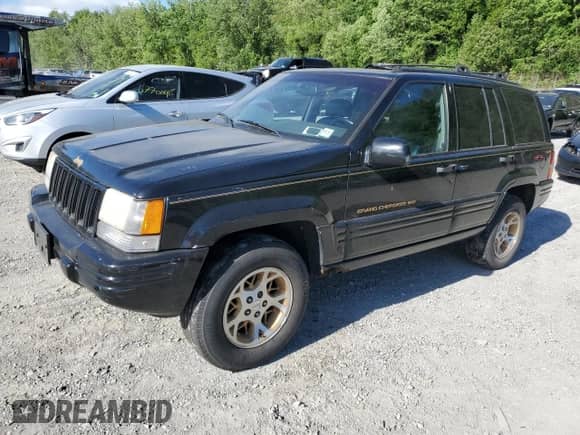 1998 Jeep Grand Cherokee Limited z VIN 1J4GZ78S0WC113869, wystawiony jako Copart lot #57723765 z przebiegiem 114 309 mil mil oraz Czysty tytuł • Clean title. Historia ofert i sprzedaży dostępna na DreamBid. Obrazek 1.