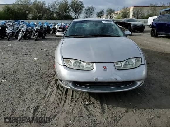 2001 Saturn SC with VIN 1G8ZY14701Z255767, listed as a Copart auction lot 53727985 with 137,776 mi miles and Salvage title. Bid and sale history available at DreamBid. Image 14.