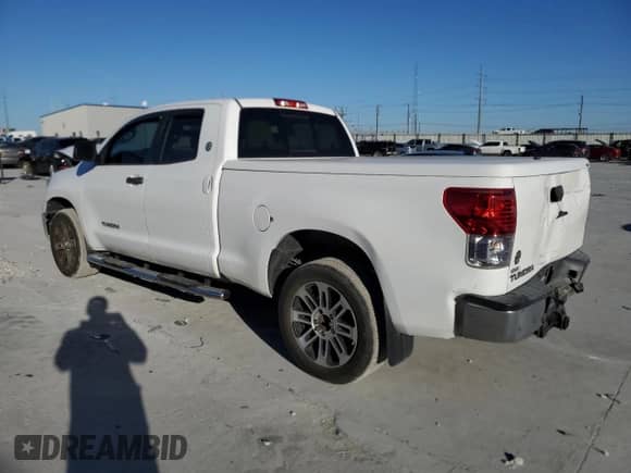 2012 Toyota Tundra z VIN 5TFRM5F13CX040352, wystawiony jako Copart lot #82679795 z przebiegiem 131 423 mil mil oraz Szkoda całkowita • Salvage title. Historia ofert i sprzedaży dostępna na DreamBid. Obrazek 2.