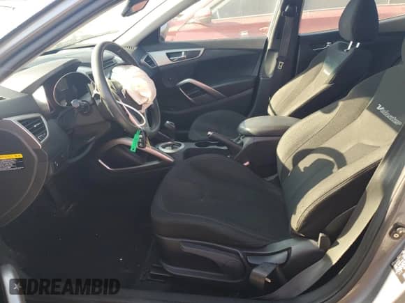 2012 Hyundai Veloster w/Black Int z VIN KMHTC6AD7CU028864, wystawiony jako Copart lot #66377895 z przebiegiem 130 440 mil mil oraz Szkoda całkowita • Salvage title. Historia ofert i sprzedaży dostępna na DreamBid. Obrazek 7.