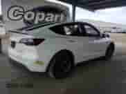 2022 Tesla Model Y Performance с VIN 7SAYGDEF0NF487098, выставлен на аукционе Copart как лот 80744715 с пробегом 39 557 миль миль и Списание • Salvage title. История ставок и продаж доступна на DreamBid. Изображение 3.