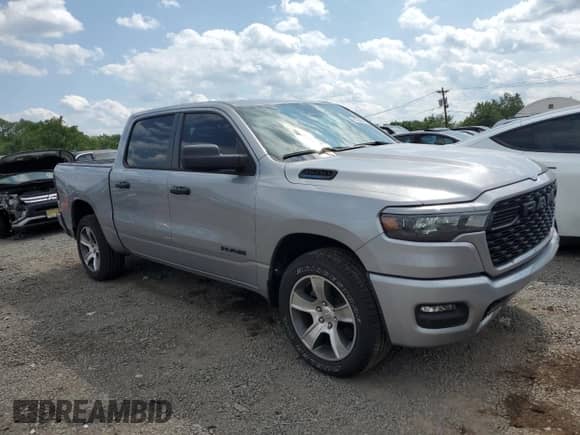 2025 Ram 1500 Tradesman with VIN 1C6RREGG1SN645797, listed as a Copart auction lot 61264645 with 2,386 mi miles and Salvage title. Bid and sale history available at DreamBid. Image 4.