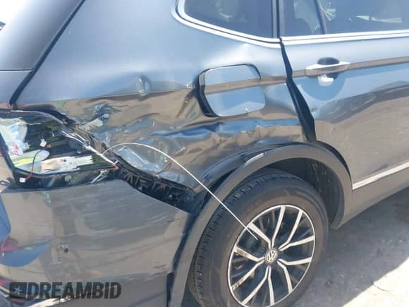 2021 Volkswagen Tiguan SE with VIN 3VV3B7AX3MM060953, listed as a IAAI auction lot 42866063 with 64,109 mi miles and . Bid and sale history available at DreamBid. Image 6.