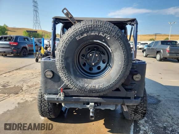 1997 Jeep Wrangler Sport with VIN 1J4FY19SXVP483096, listed as a Copart auction lot 71246695 with 261,698 mi miles and Salvage title. Bid and sale history available at DreamBid. Image 6.