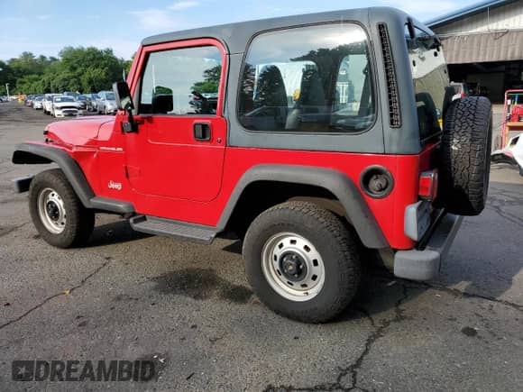 2000 Jeep Wrangler SE with VIN 1J4FA29P8YP711686, listed as a Copart auction lot 68999455 with 100,108 mi miles and Salvage title. Bid and sale history available at DreamBid. Image 2.
