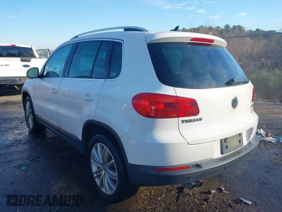 2014 Volkswagen Tiguan SEL with VIN WVGAV3AX8EW538318, listed as a IAAI auction lot 41277703 with 130,827 mi miles and . Bid and sale history available at DreamBid. Image 3.