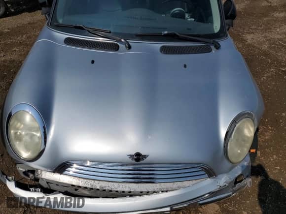 2004 MINI Hardtop with VIN WMWRC33454TJ56308, listed as a Copart auction lot 59690865 with 99,374 mi miles and Salvage title. Bid and sale history available at DreamBid. Image 11.
