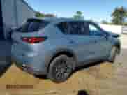 2025 Mazda CX-5 S Carbon Edition z VIN JM3KFBCM6S0679834, wystawiony jako Copart lot #87410845 z przebiegiem 13 497 mil mil oraz Czysty tytuł • Clean title. Historia ofert i sprzedaży dostępna na DreamBid. Obrazek 3.
