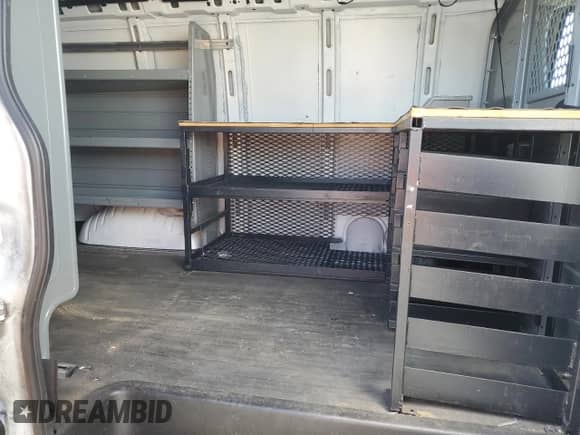 2018 Chevrolet Express Cargo с VIN 1GCWGAFG4J1338495, выставлен на аукционе Copart как лот 88013295 с пробегом 141 681 миль миль и Списание • Salvage title. История ставок и продаж доступна на DreamBid. Изображение 11.