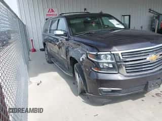 2015 Chevrolet Suburban LTZ z VIN 1GNSCKKCXFR627304, wystawiony jako IAAI lot #42826425 z przebiegiem 137 294 mil mil oraz . Historia ofert i sprzedaży dostępna na DreamBid. Obrazek 1.